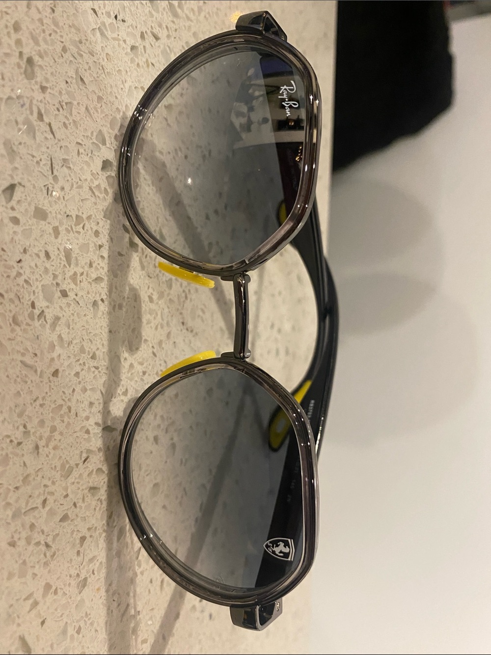 Ray-Ban Black Sunglasses with Gray Lenses and Yellow Accents